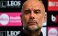 Pep Guardiola em entrevista coletiva (Foto: Glyn Kirk / AFP